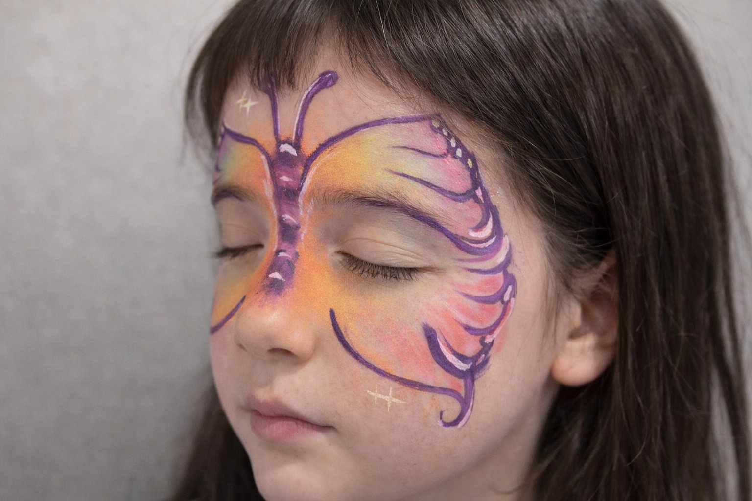 Watercolour butterfly face paint design